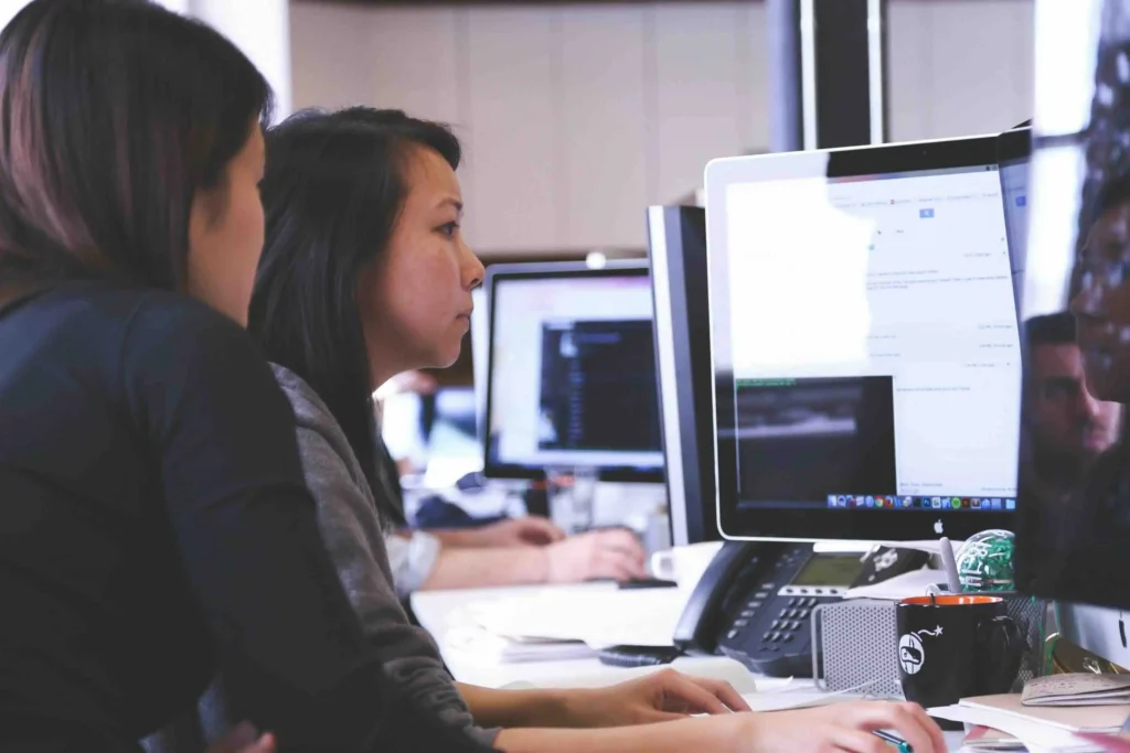 woman looking at data on her computer