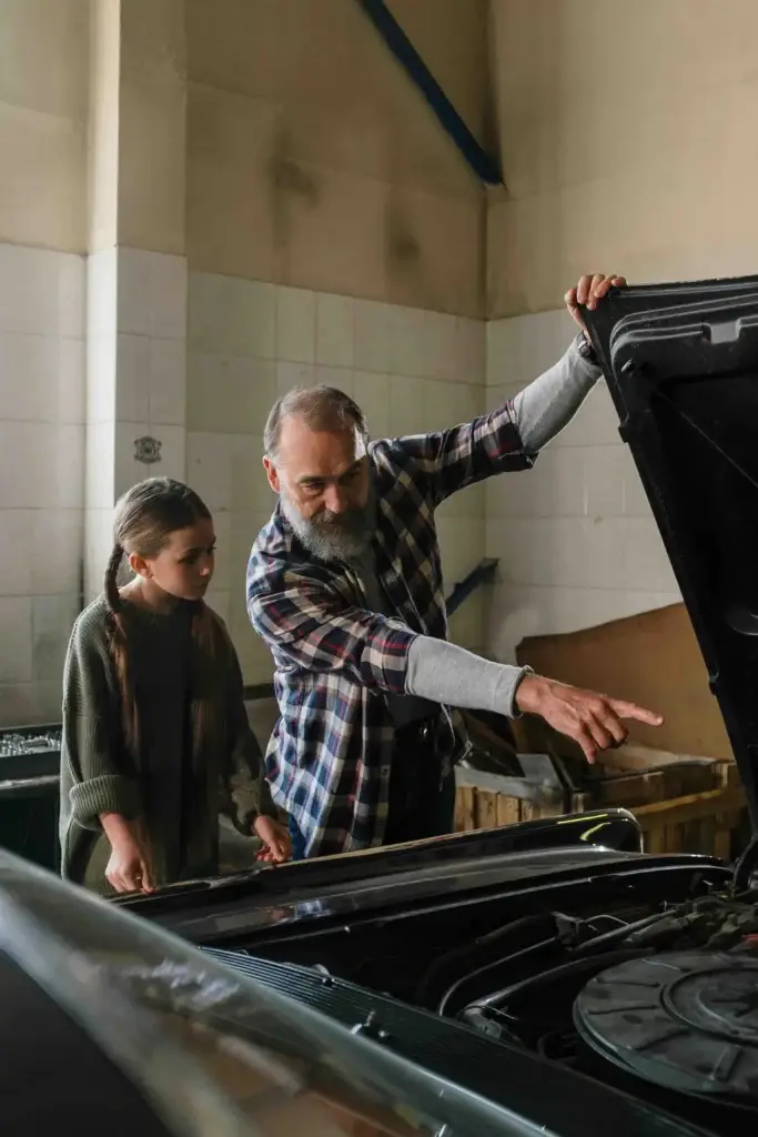 Father and Daughter Talking About Engines