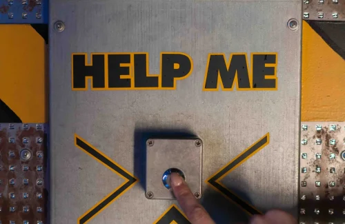 hand pressing a power button