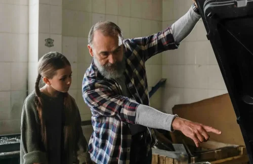 Father and Daughter Talking About Engines