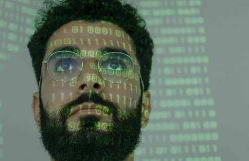 Man looking at a coding screen