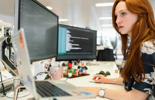 Woman looking at the monitor for phone calls